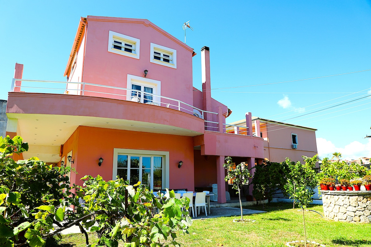 Exterior view of Akobara Villa in Corfu, Greece, with garden